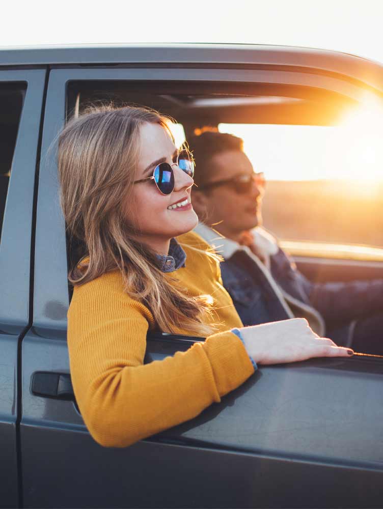 young man walking through city on his mobile phone
